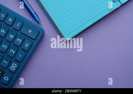 top view of calculator,pen and notepad on table  Stock Photo