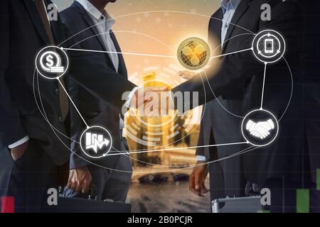 Ripple XRP and cryptocurrency payment acceptance concept - Businessman handshaking showing accepted payment by using Ripple coin. Blockchain and finan Stock Photo