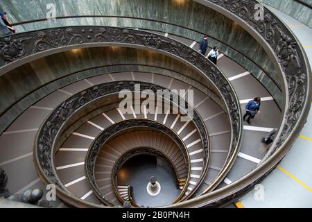 Visitors descend the Bramante Staircase, a modern double-helix stairway inside the Vatican Museum, Vatican City, Vatican Stock Photo