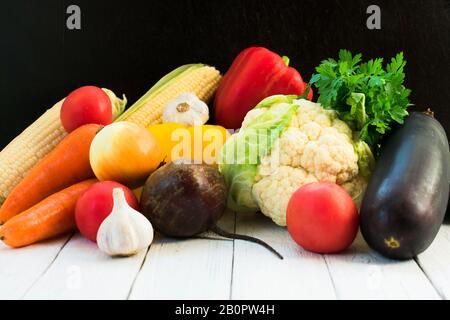 Lots of fresh seasonal vegetables on the table. Healthy food concept. Stock Photo