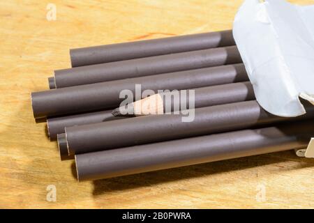 Sepia coloured pencils in a white cardboard box Stock Photo