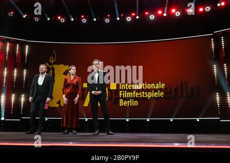 (200221) -- BERLIN, Feb. 21, 2020 (Xinhua) -- Berlinale Executive Director Mariette Rissenbeek (C) and Berlinale Artistic Director Carlo Chatrian (R) attend the opening ceremony of the 70th Berlin International Film Festival in Berlin, capital of Germany, Feb. 20, 2020. The 70th Berlin International Film Festival, or as it's more commonly known, the Berlinale, kicked off on Thursday with a literary drama 'My Salinger Year'.A total of 18 films have made it into this year's competition category and they will compete for the Golden Bear for best film, and other individual awards, the Silver Bears Stock Photo