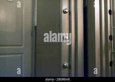 Locking mechanism of solid vault door in a bank. Stock Photo