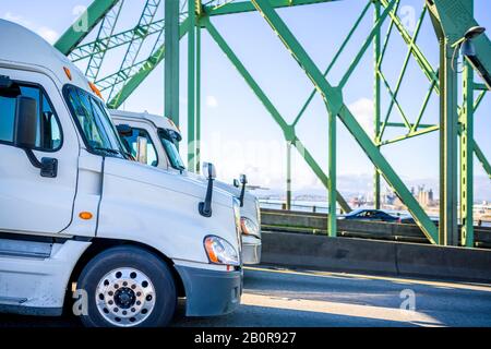 Different long haul diesel Big rigs semi trucks with semi trailers ...