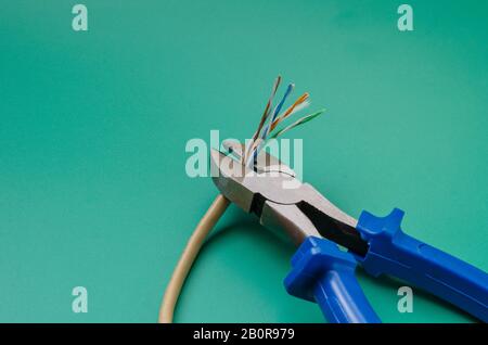 Old LAN cable with thin wires without braid. Eye level shooting. Close-up. Selective focus. Stock Photo