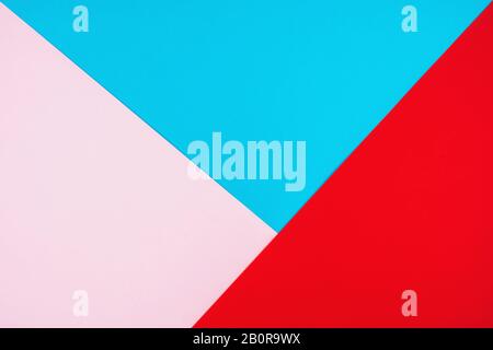 Three-color background in bright colors. Pastel colors of blue, pink and red. Stock Photo