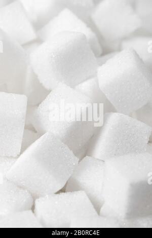Close up macro studio shot of white sugar cubes Stock Photo