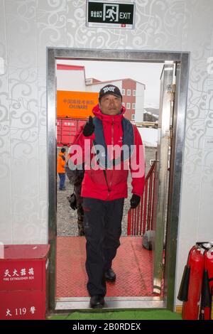 Chinse tourists from an expedition cruise ship visiting the museum at the Great Wall Station, Chinas first Antarctic research station on King George I Stock Photo