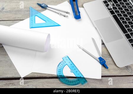 Architect workplace with open laptop and instruments top view Stock Photo