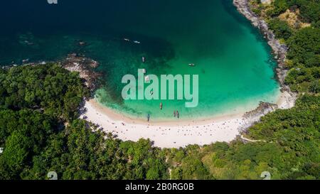 Freedom beach, Phuket, Thailand - January, 2020: Aerial shooting of Freedom beach, Phuket, Thailand. Beautiful tropical island with white sand beach a Stock Photo
