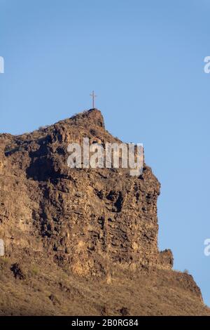 Wooden cross on the mountain top Stock Photo