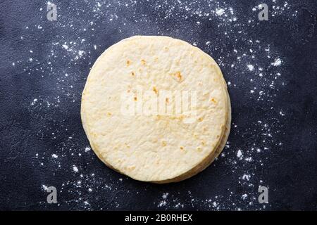 Tortillas, flat breads on dark grey background. Copy space. Top view. Stock Photo