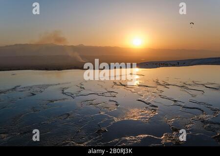 Sunset over the water terraces of Pamukkale, Denizli, Turkey Stock Photo