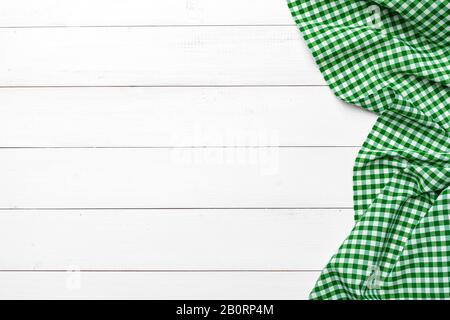 checkered tablecloth on wooden table. creative photo. Stock Photo