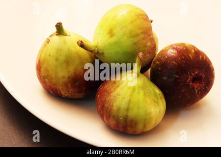 Figs in white plate Stock Photo