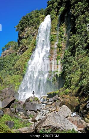 Sagada, Mountain Province, Philippines: Scenic view of Bomod-ok Waterfalls near Banga'an village, surrounded by lush vegetation Stock Photo