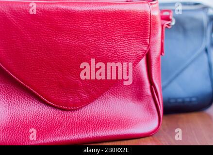 Women's leather bag close-up on the table, selective focus. Stock Photo