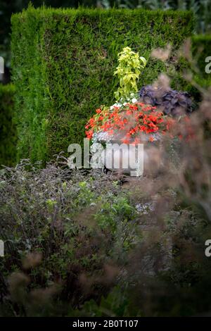 Decorative flower urns in a formal park Stock Photo