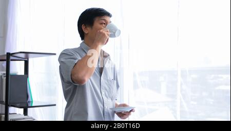 Senior Asian man drinking coffee on relaxing time Stock Photo