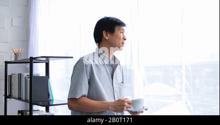Senior Asian man drinking coffee on relaxing time Stock Photo