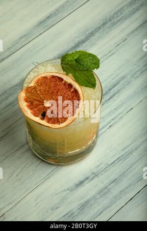 Orange Mojito made with white rum, mint leaves, orange and lime wedges topped with soda Stock Photo