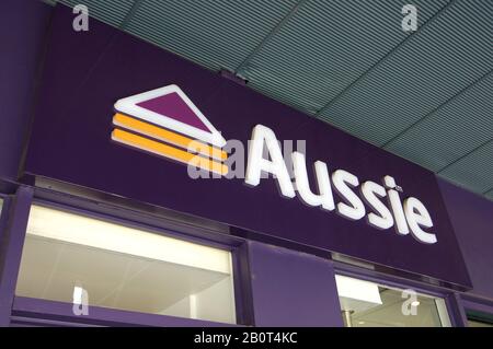 Brisbane, Queensland, Australia - 29th January 2020 : Aussie sign hanging in front of a store in West End, Brisbane. Aussie home loans is a mortgage b