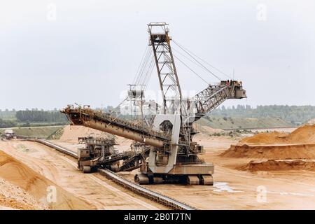 Giant bucket wheel excavator. The biggest excavator in the world. The largest land vehicle. Excavator in the mines. Stock Photo