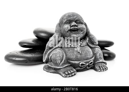 happy buddha statue with massage stone isolated on white Stock Photo