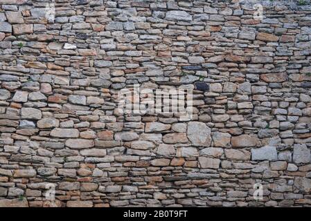 Background Acient Stone Wall Pattern in the Lugo Roman Wall Stock Photo