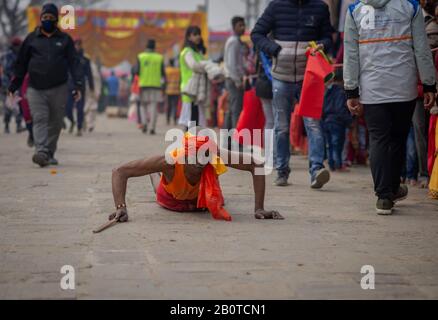 Kathmandu, Nepal. 21st Feb, 2020. A Sadhu (holy man) offers prayers during the festival at Pasupatinath Temple in Kathmandu.Maha Shivaratri is a Hindu festival celebrated annually in honor of Lord Shiva and in particular, marks the night when Shiva performs the heavenly dance. Credit: SOPA Images Limited/Alamy Live News Stock Photo