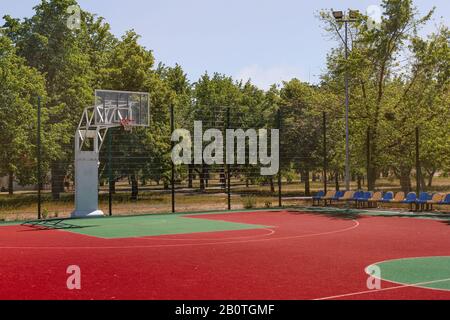 Outodor colorful basketball court in the city park. Stock Photo