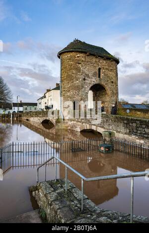 Record breaking high river levels threaten to ovewhelm the historic Monnow bridge, at Monmouth in South Wales. February 2020. Stock Photo