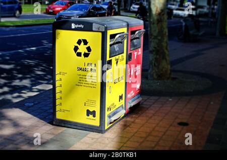 Smart bins for recycling and general waste found in the city of Melbourne, solar powered and can compact seven times more waste then regular bins Stock Photo