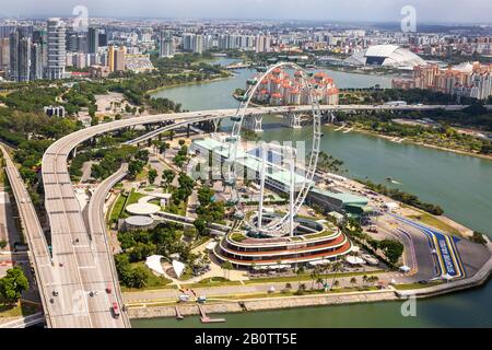 High view of Singapore skyline with the Singapore Flyer Ferris wheel and the racetrack for the Singapore Grande Prix, Singapore Stock Photo