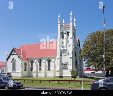 cityscape of historical village with side of historical Gothic St. James church, shot in bright late spring light at Thames, Coromandel, North Island, Stock Photo