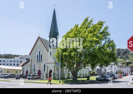 THAMES, NEW ZEALAND - November 07 2019: cityscape of historical village with side of historical St.Georges Anglican church, shot in bright late spring Stock Photo