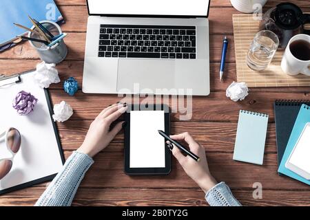 Businesswoman using tablet computer at office Stock Photo