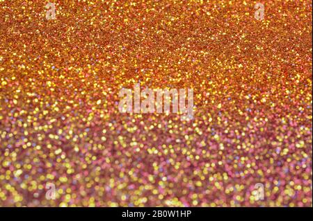 Colorful sparkling stardust surface with nice bokeh. Abstract background for festive effect. Stock Photo