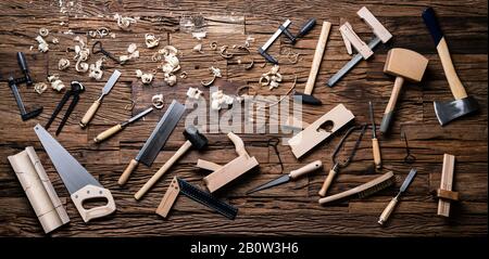Various Carpenter Tools From Toolkit Laying On Desk Stock Photo