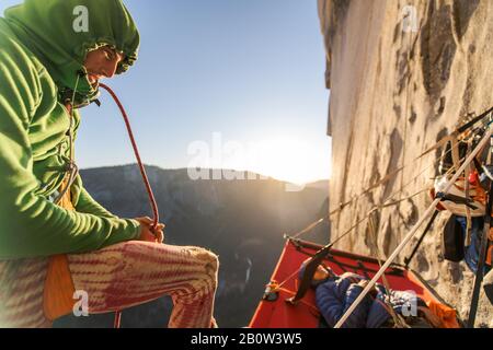 Two mountaineers in a portaledge on The Nose, El Capitan, Yosemite National Park. Stock Photo