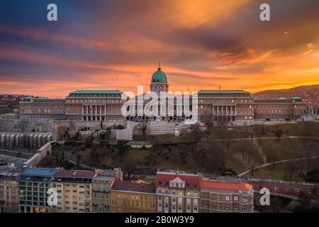 Budapest, Hungary - Aerial view of Buda Castle Royal Palace with a dramatic golden sunset at winter time Stock Photo