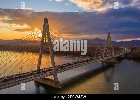 Budapest, Hungary - Megyeri Bridge over River Danube at sunset with heavy traffic and beautiful sky and clouds Stock Photo