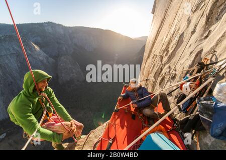 Two mountaineers in a portaledge on The Nose, El Capitan, Yosemite National Park Stock Photo