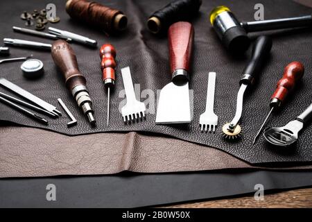 Leather Craft Tools On Desk In Tailoring Workshop Stock Photo