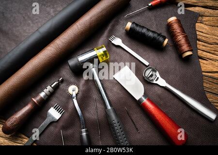 Leather Craft Tools On Desk In Tailoring Workshop Stock Photo