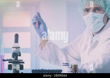 Scientist doing medical experiments  at the laboratory Stock Photo