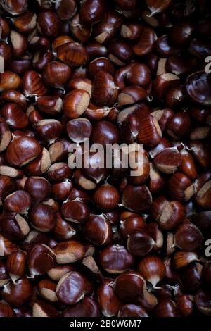 ripe chestnuts in Italian food market Stock Photo