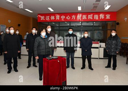 Wuhan, Hubei Province. 21st Feb, 2020.Chinese Vice Premier Sun Chunlan, also a member of the Political Bureau of the Communist Party of China Central Committee, talks to medical workers from Jiangsu and Guizhou via video links in a temporary hospital converted from a gymnasium in Wuhan, capital of Hubei Province, Feb. 21, 2020. The central government team leading by Sun Chunlan, has studied the rotation of medical workers, strengthened guidance on hospital infection protection and improved psychological counseling in the COVID-19 epicenter. Credit: Xinhua/Alamy Live News Stock Photo