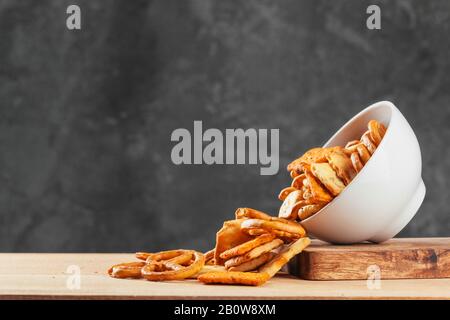 Beer snacks on stone and wooden background. Top view, copy space Stock Photo