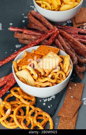 Lager beer mug and snacks on wooden table. Nuts, chips, dry fish Stock ...